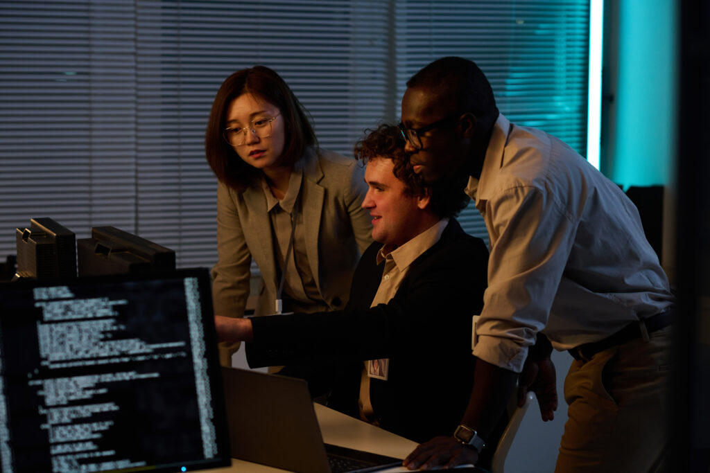 Developers working with computer codes in team