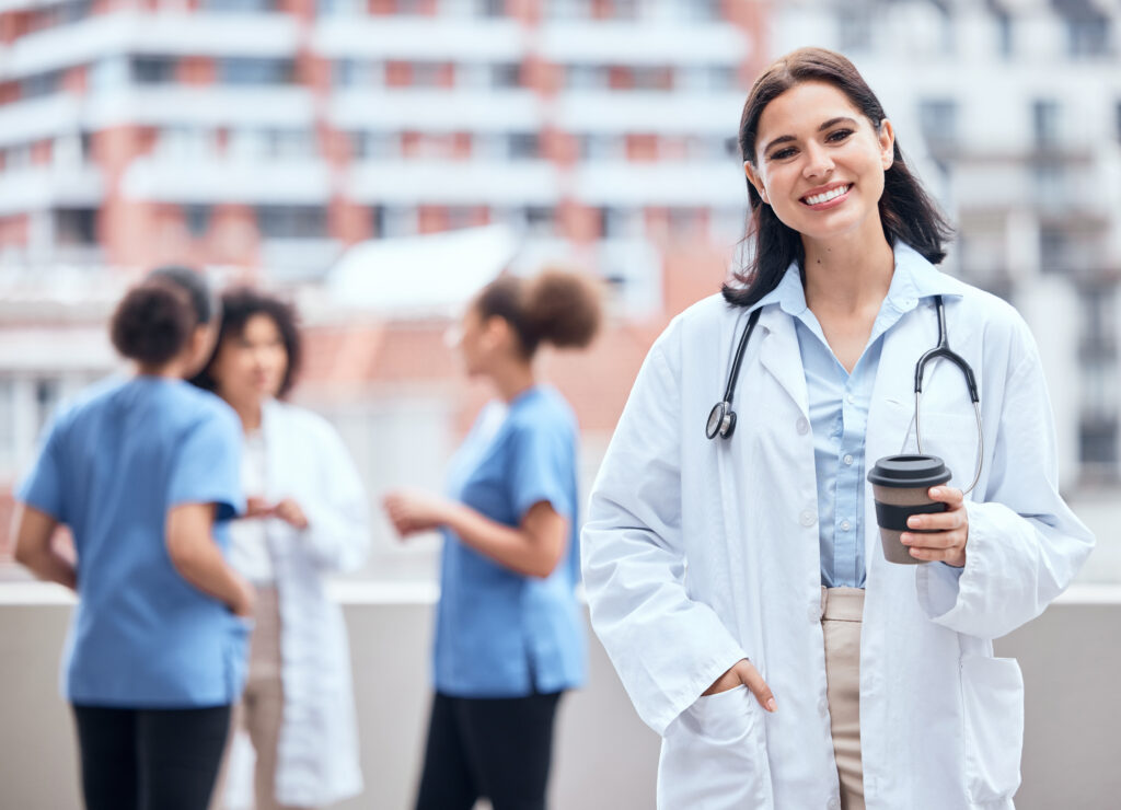 portrait-of-smiling-young-doctor-enjoying-a-cup-of-2025-04-06-10-44-41-utc